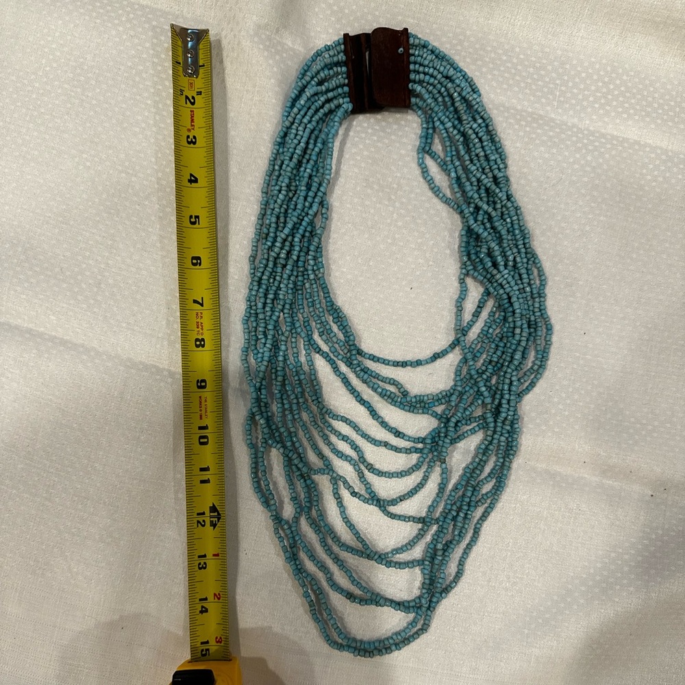 Beaded necklace with wooden clasp